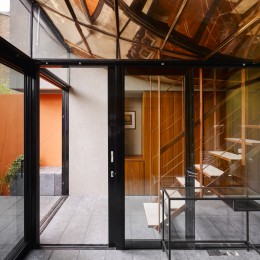 Interior view of living area showing glass doors to courtyard