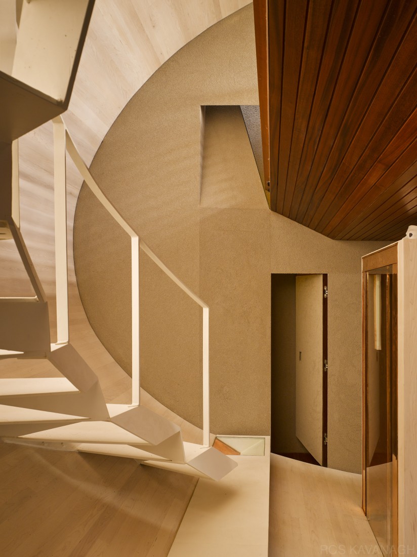 Interior view of corridor showing stairs and open doorway