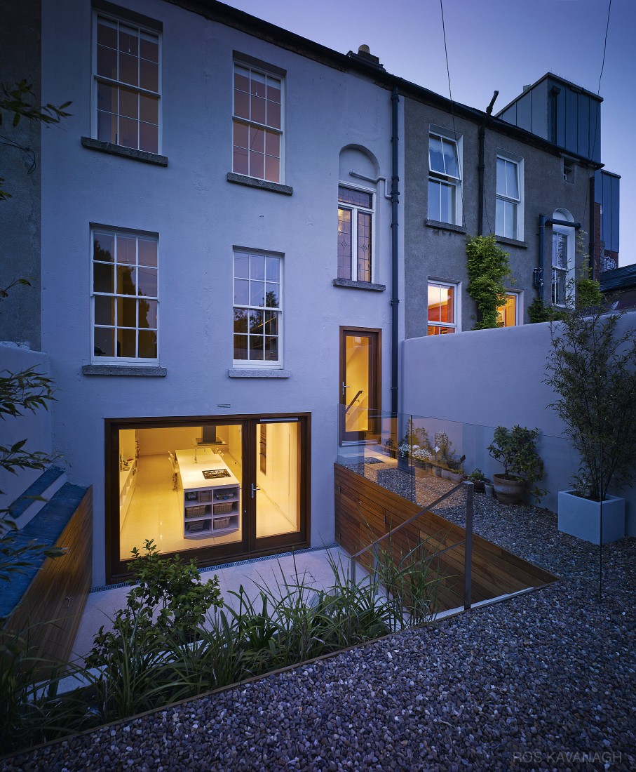 Dusk view of rear of house