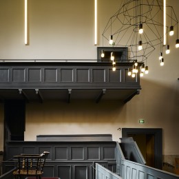 Interior view of court room showing benches and chandelier