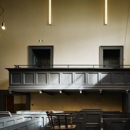 Interior view of court room showing benches and lighting