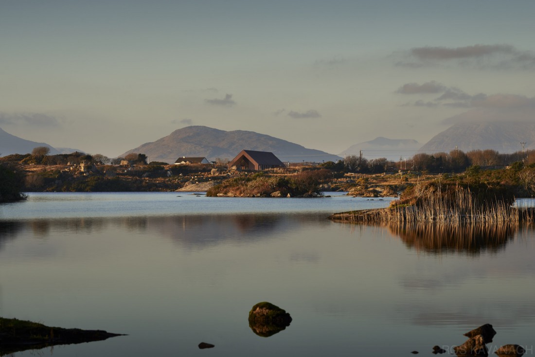 Exterior view of centre across Lough Aroolagh showing the Twelve Pins Mountains
