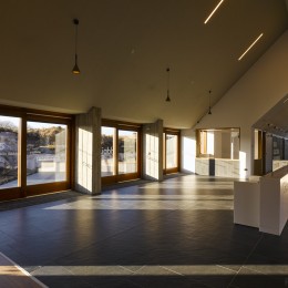 Interior view of reception area showing slate floors and glass walls